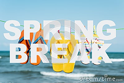 Text spring break and flip-flops on the beach Stock Photo