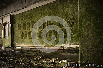 Text there is no god on the dirty wall in an abandoned ruined house Stock Photo