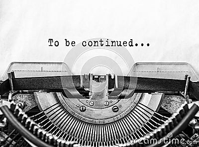 Text To be continued... typed words on a old Vintage Typewriter. Stock Photo