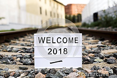 Text welcome 2018 in a lightbox on the railway Stock Photo