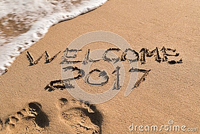 Text welcome 2017 in the sand of a beach Stock Photo