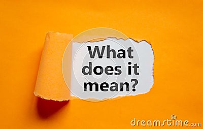 The text `what does it mean` appearing behind torn orange paper. Business concept, copy space Stock Photo