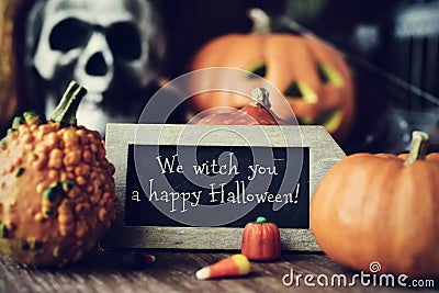 Text We witch you a happy Halloween in a chalkboard Stock Photo