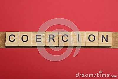 Text the word coercion from gray wooden small letters Stock Photo
