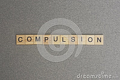 Text the word compulsion from gray wooden small letters Stock Photo
