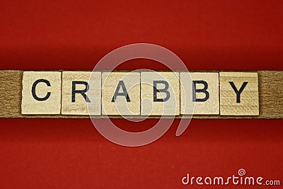 Text the word crabby from gray wooden small letters Stock Photo