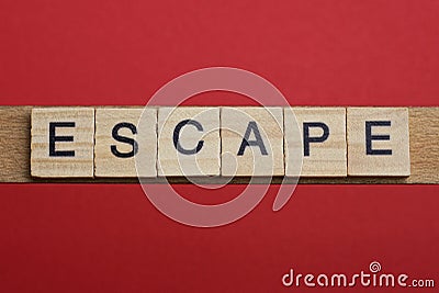 Text the word escape from gray wooden small letters Stock Photo