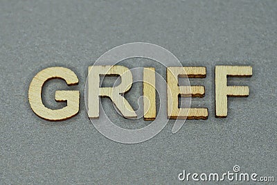 Text the word grief from gray wooden small letters Stock Photo