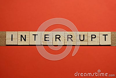 Text the word interrupt from gray wooden small letters Stock Photo