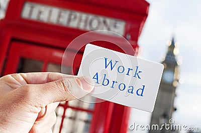 Text work abroad in a signboard with the Big Ben in the backgrou Stock Photo