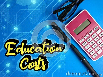 Text written Education Costs, pen, calculator and glasses. Education and finance concept Stock Photo