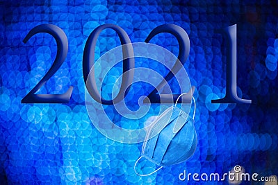 Text with the year number 2021 with a background of out-of-focus bright blue lights with Bokeh effect Stock Photo