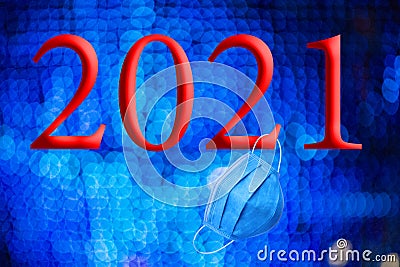 Text with the year number 2021 with a background of out-of-focus bright blue lights with Bokeh effect Stock Photo