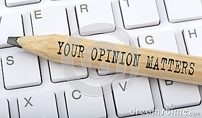 Text YOUR OPINION MATTERS on wooden pencil on white keyboard. Business concept Stock Photo