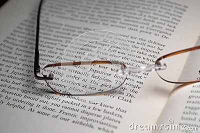 Textbook and glasses Stock Photo