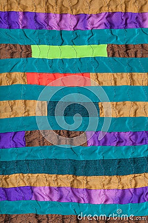 Stitched patchwork scarf from many narrow bands Stock Photo