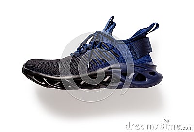 Textile sport shoe with laced fastening isolated on white background. Grooved men sneakers of black blue colors cutout. Laced up Stock Photo