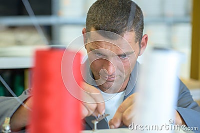 Textile weaver at work Stock Photo