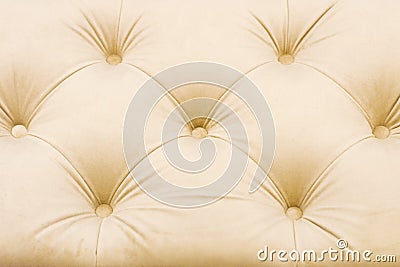 Textural rhomb ornament on light upholstery. Stock Photo