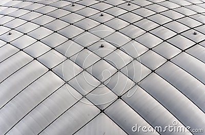 Texture background depicting a close up on a symmetrical checkered pattern of a dome-shaped roof. Editorial Stock Photo