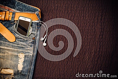 Texture background of jeans , belt detail with mobilephone and e Stock Photo