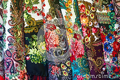 Texture background, pattern. Different fabrics stacked on a table in a pile Stock Photo