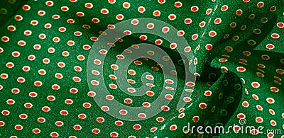 Texture background, pattern, green silk fabric with red polka dots. Light and silky-soft satin pendant is perfect for your design Stock Photo