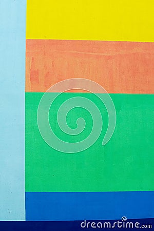 Texture, background, pattern. The wall of the building is painted with bright colors, a game of shadows from trees Stock Photo