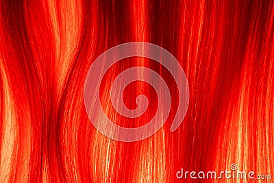 Texture of blonde combed hair illuminated by red light. Strands of light woman hair. Curl of healthy natural female hair Stock Photo