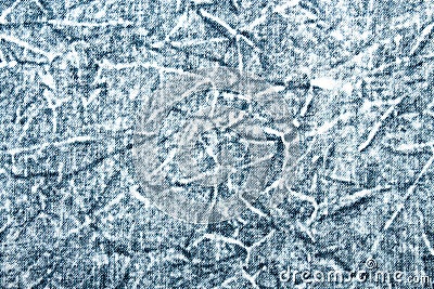 The texture of faded denim jeans.Background of boiled denim. Stock Photo