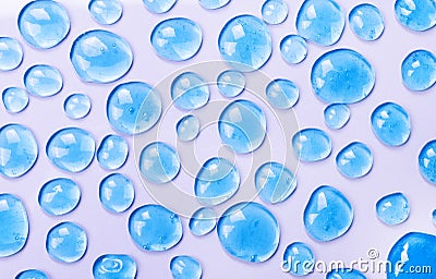 Texture of blue gel on a pink background as a background of cosmetics, hygiene and science close-up. Cosmetic serum, serum drops Stock Photo