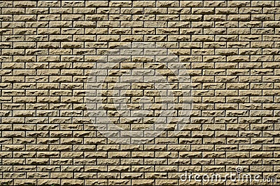 Texture of brick wall from relief stones under bright sunligh Stock Photo