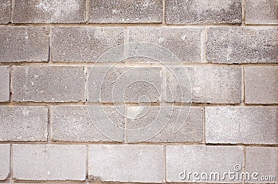 The texture of the bricks. Brick background. Background of bricks. Gray bricks. Concrete blocks. Part of the concrete wall. Gray Stock Photo