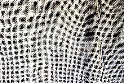 Texture of brown old canvas, linen natural material with a coarse perpendicular interlacing of the fibers of the fabric Stock Photo