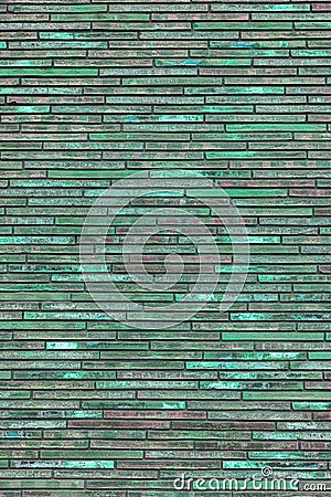 Texture of decorative green brick wall. House facade. Stock Photo