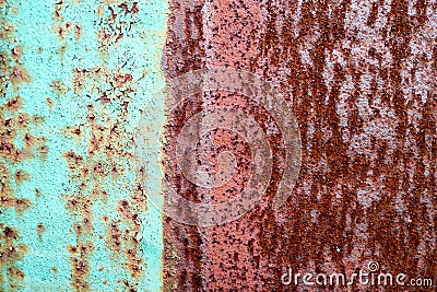 The texture is divided into half a rusty two-color red and green old shabby oxidized metal, iron with expanded white paint, pits a Stock Photo