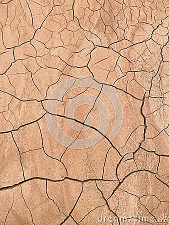 The texture of dry, cracked, scorched earth. Stock Photo