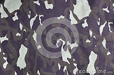 Texture of fabric with a camouflage painted in colors of the marsh. Army background image. Textile pattern of military camouflage Stock Photo
