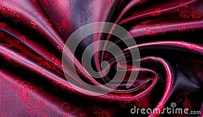 Texture, fabric, red silk with paisley pattern. This beautiful printed silk Charmeuse has a bold paisley pattern. In the patriotic Stock Photo