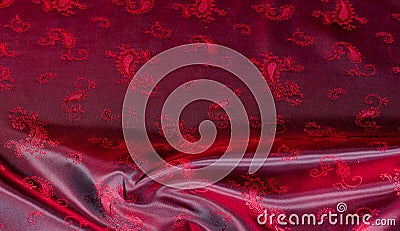 Texture, fabric, red silk with paisley pattern. This beautiful printed silk Charmeuse has a bold paisley pattern. In the patriotic Stock Photo
