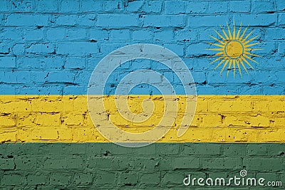 Texture of a flag of Rwanda on a brick wall. Stock Photo