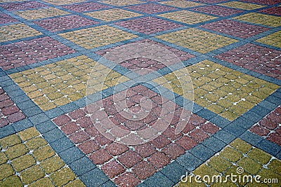 Texture of a fragment of a square old paving slab on the road Stock Photo