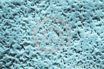 Texture of friable turquoise snow Stock Photo