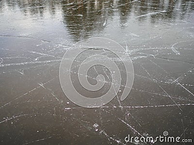 Texture of frozen ice on the lake with traces of skates Stock Photo