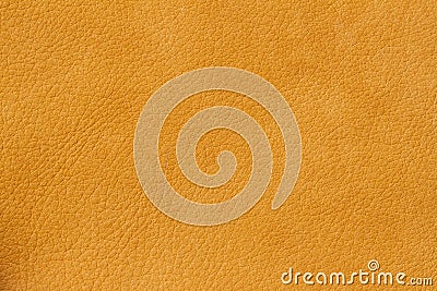 Texture of genuine leather close-up, cowhide. Sunny orange color. For natural, artisan backgrounds, substrate Stock Photo