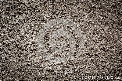 The texture of a gray concrete wall with sharp drops of light and shadow Stock Photo