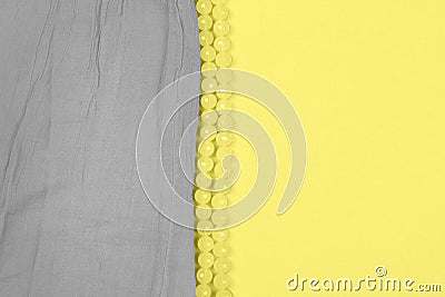 Gray cotton fabric on illuminating and bright yellow Stock Photo