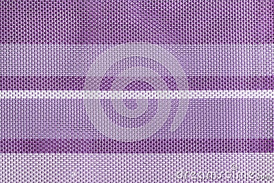 The texture of a large weaving closeup textiles. Background with purple and lilac stripes. Stock Photo