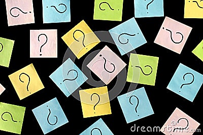 Texture from a leaflet with question marks on a black background. Stock Photo