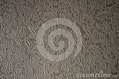 Texture of light brown wallpaper with a floral glossy pattern. Structured paper Stock Photo